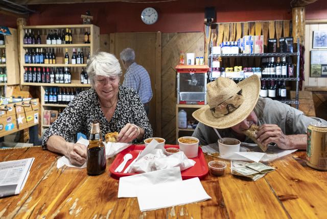 Two diners enjoying a meal at the rustic Abe's Cantina y Cocina in Arroyo Seco.