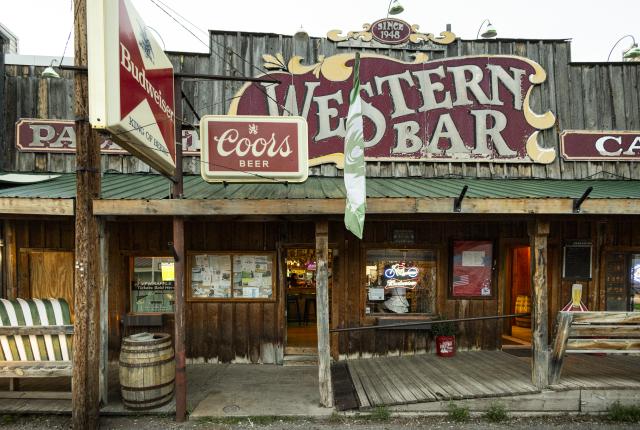 Historic Western Bar in Cloudcroft, with rustic wooden façade and Coors sign.