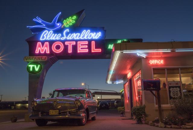 The neon sign at the Blue Swallow Motel in Tucumcari calls for a road trip in your favorite ride.