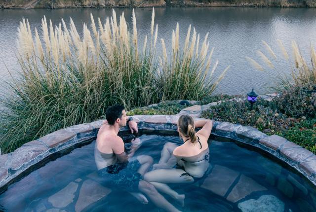 Relaxing at Riverbend Hot Springs is like soaking in a warm infinity pool in the desert.
