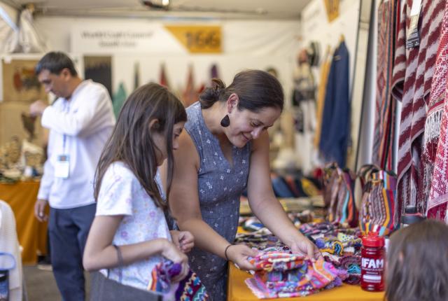 Mother and daughter shopping at the International Folk Art Market.