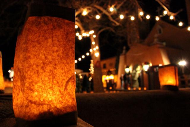 On Christmas Eve, thousands of farolitos light up the paths to San Felipe de Neri Church in Albuquerque’s Old Town.
