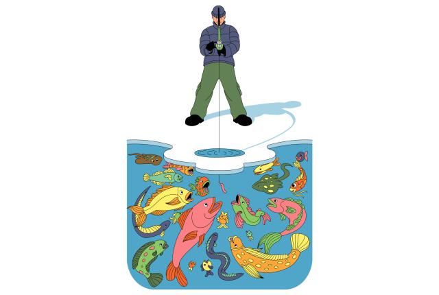 A person in winter clothing ice fishing, standing above a hole. Vibrantly colored fish swim underneath.