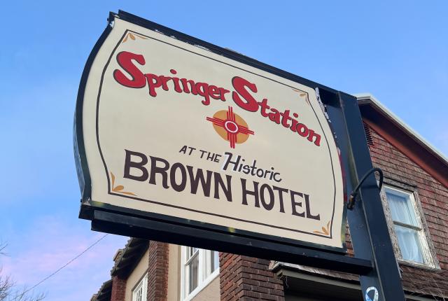 Exterior of Springer Station, a restored historic hotel with vintage Western character and updated accommodations.