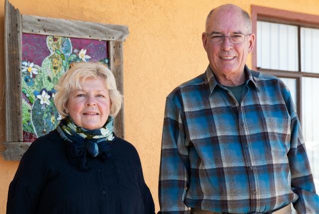 Mike and Debbie Pogue standing in the Sunset Motel.