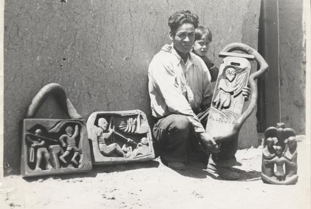 Patrocino Barela and son with several sculptures