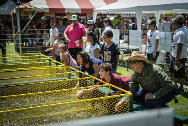 Contestants watch their ducks compete in the Great American Duck Race, in Deming, New Mexico.