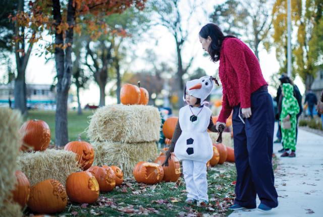 Little girl, dressed as Olaf from Frozen, and her grandmother at Los Alamos Halloween