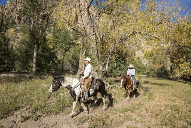 Ride horses with Geronimo Trail Guest Ranch.