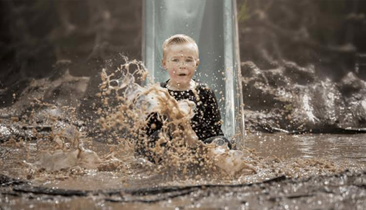 child in mud at bear trail