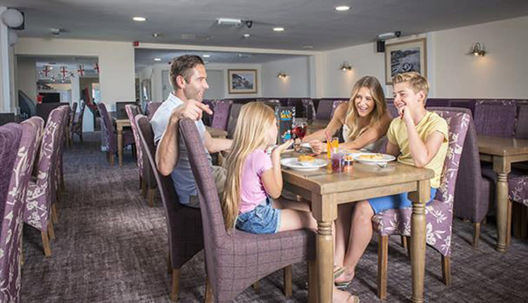 family eating in holiday park club