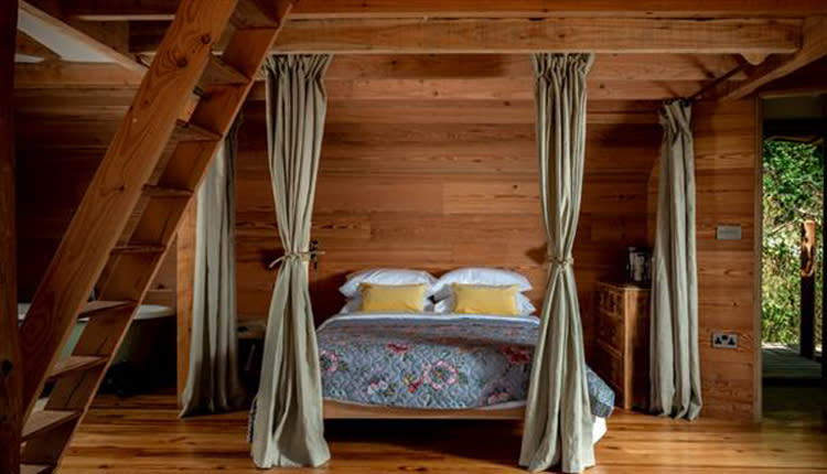 double bed in wooden room