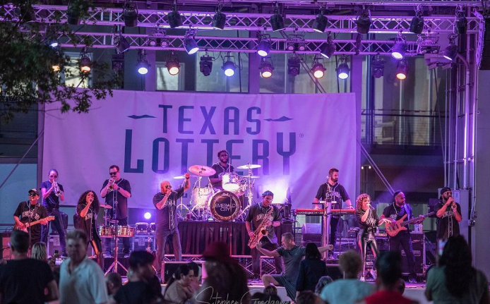 Band Playing In front Of Crowd At Texas Lottery Plaza In Irving, TX