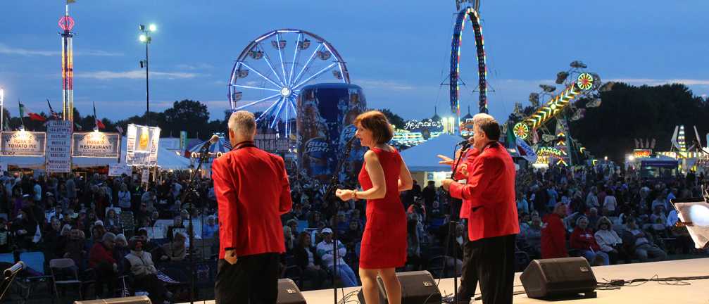 3 People performing onstage at a concert