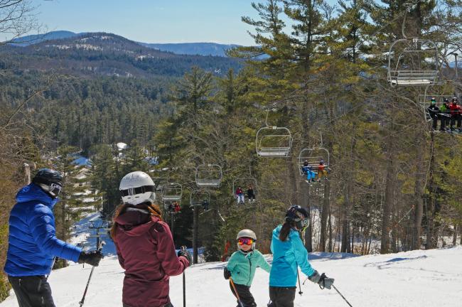 King Pine Ski Area - Family Looking at Chairlift