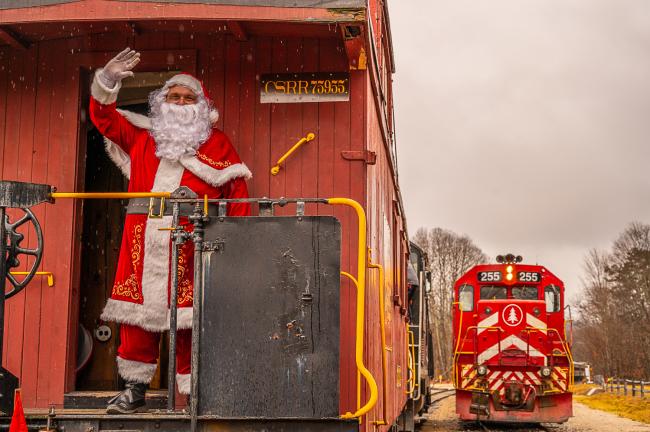 Santa Waving from the Back of a Conway Scenic Railroad Train