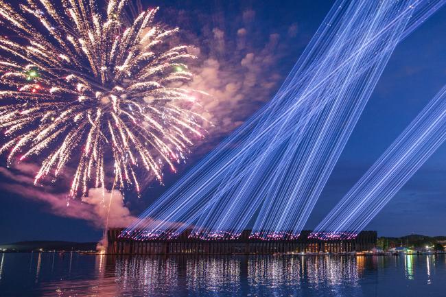 Lasers on the Ore Dock and Fireworks over Lake Superior for Independence Day Celebration in Marquette, Michigan.