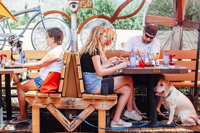 Patrons at the tables on the patio of O.H.S.O in Phoenix, AZ