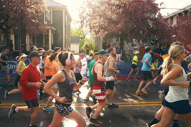People running down the street for the Burlington City Marathon.