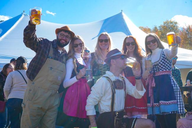 Attitash Mountain Resort Oktoberfest - Friends in Bavarian Outfits with Beer