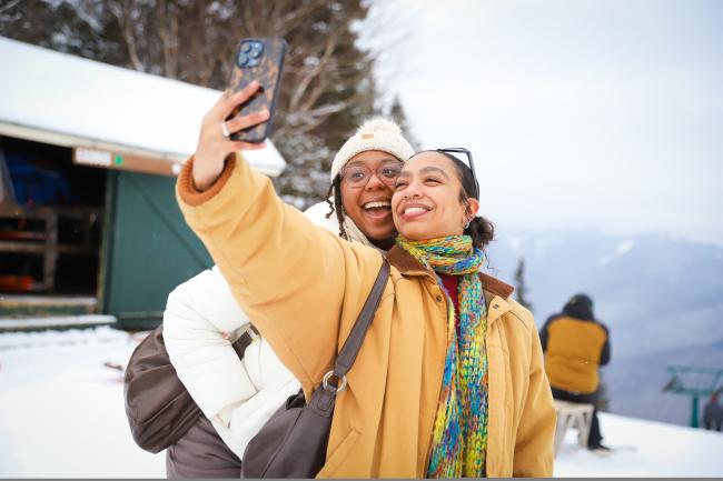 Two Women Taking a Selfie at the Summit of Loon Mountain in Winter