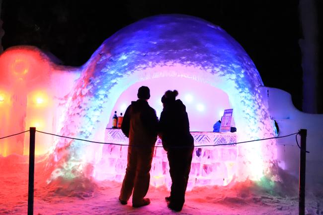 Ice Castles - Ice Bar (Couple Standing in Front of Illuminated Igloo)