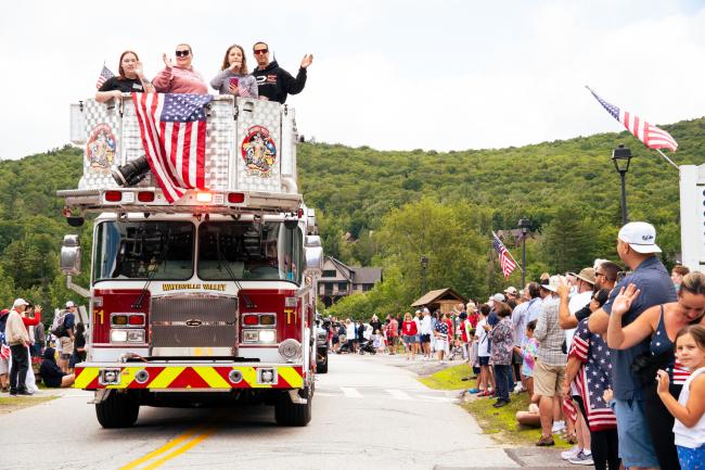 Waterville Valley 4th of July Parade - Fire Engine with People on Top Waving at Patriotic Crowd