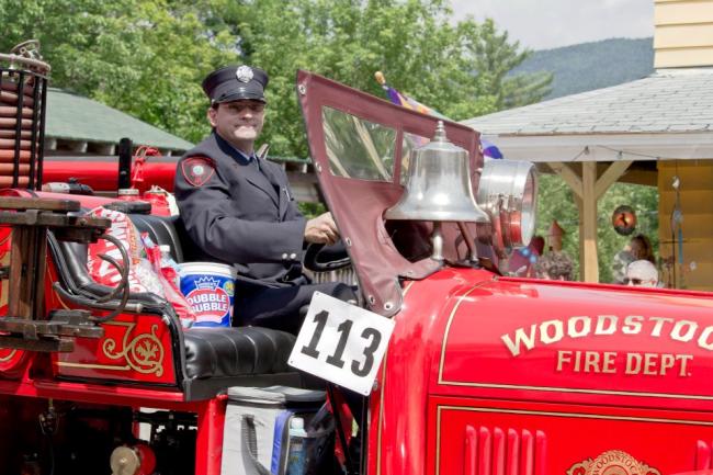 Woodstock, NH 4th of July Parade - Firefighter in Old Fashioned Fire Truck
