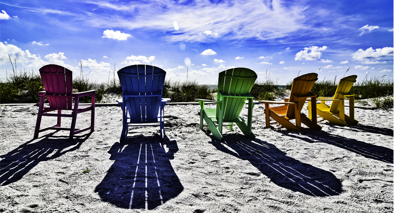 Adirondak Chairs in the sand - 800 by 433 px