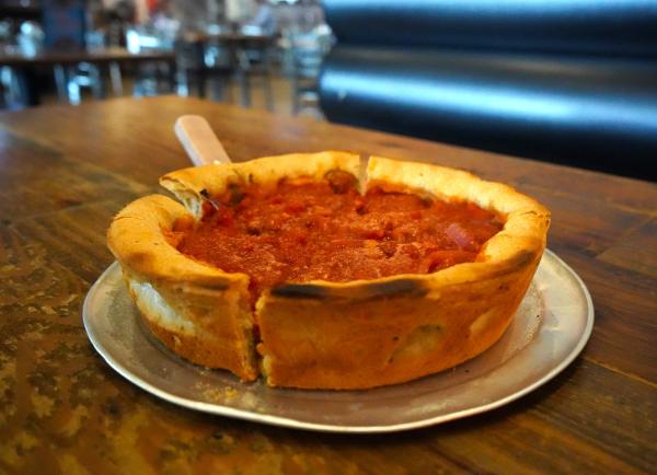 "The Deluxe" deep dish pie cools on top of a tray waiting to be served at Gusano's Pizzeria in Fort Smith, Arkansas