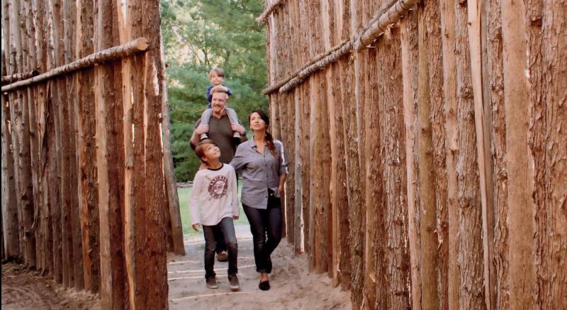 family walking into museum