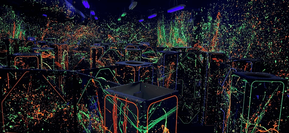 Cheyenne Ice and Events Center, neon paint splatter room with stools, a visually striking date idea near Cheyenne.