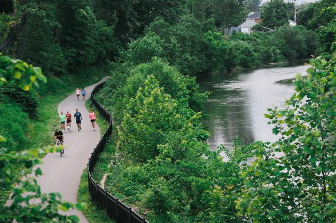 People Jogging Along The Roanoke River Greenway