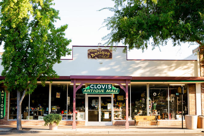 Exterior of antique shop with sign that reads "Clovis Antique Mall"