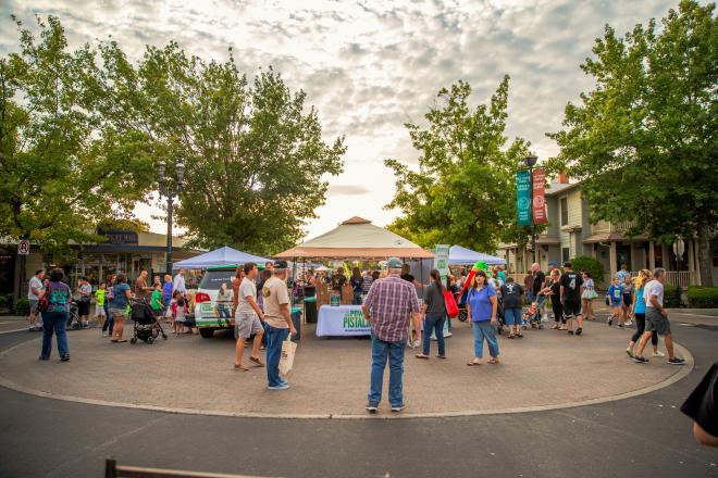 Customers shop at vendor booths at Old Town Clovis Farmers Market