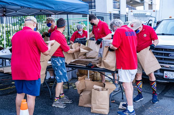 Volunteers package up crabs to go