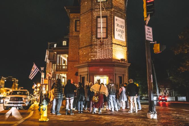 Annapolis Tours & Crawls Ghost Tour gathers in front of a haunted site