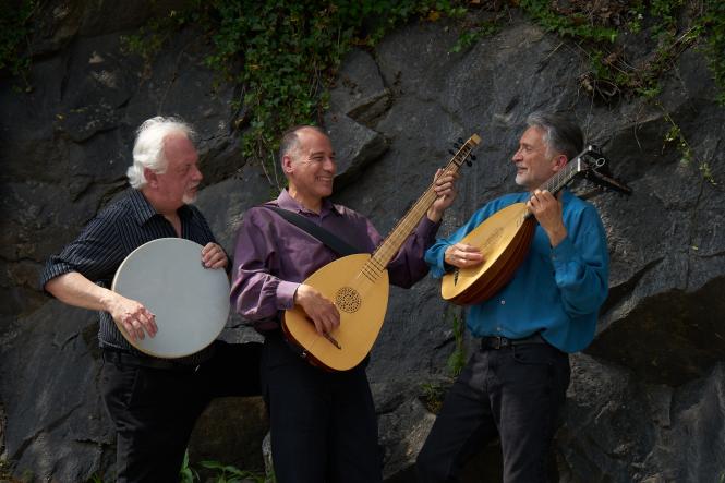 Three men holding musical instruments