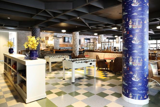 Bright colors and large table games at the Trophy Room bar at the Graduate Annapolis Hotel.