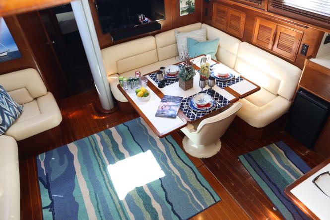 the galley and seating area of Seas the Bay