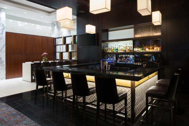 The Luminous Lounge at the Westin BWI, black stools and modern lighting