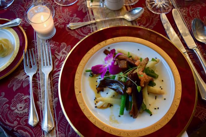 a dinner plate and table setting at Wine & Dine in the Garden