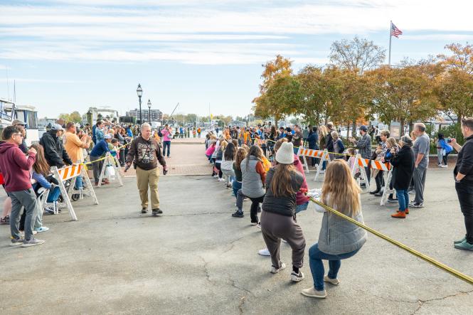 people pulling a rope at a tug of war