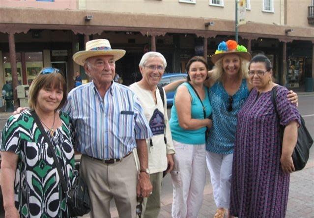 Sister Cities Committee members Gilbert Delgado and Carol Robertson Lopez, with artists from Bukhara