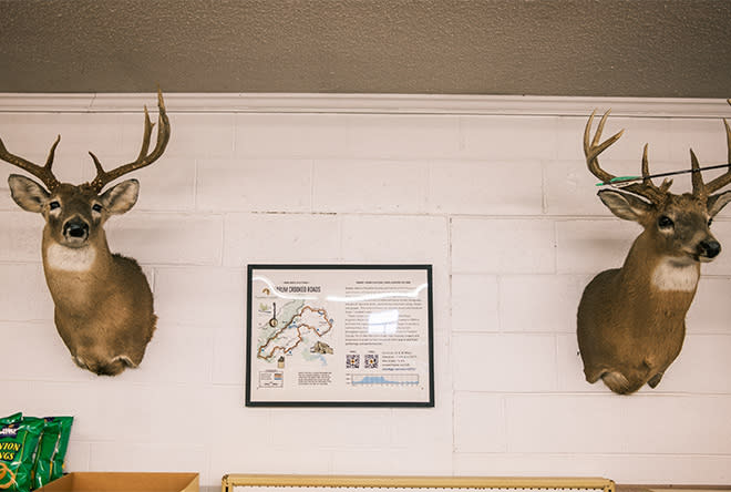 Large buck deer trophies with Gravel Adventure Field Guide map
