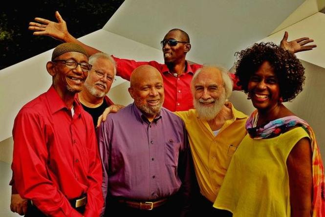 a group of musicians in colorful shirts