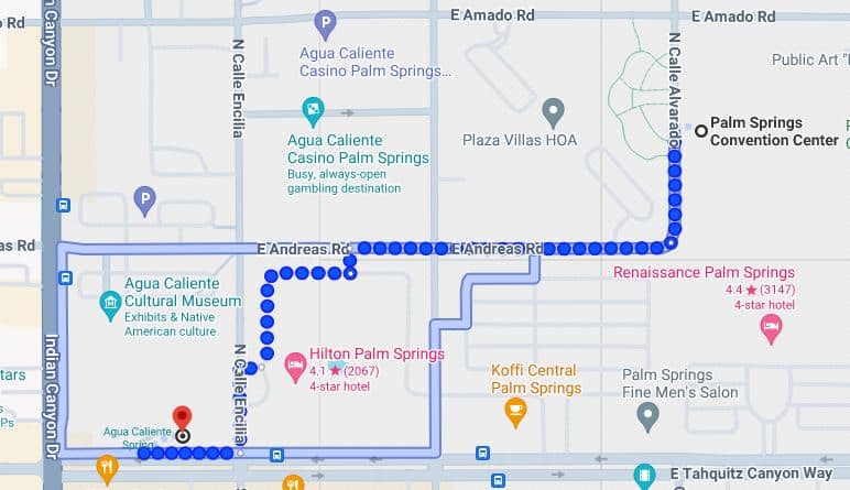 A map showing a GPS route in a city with labeled hotels, a casino, and a cultural museum, indicating street names and points of interest.