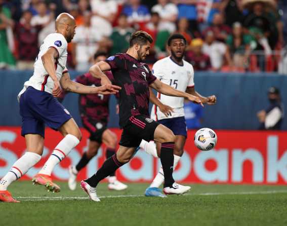 Four soccer players are shown chasing a ball at Concacaf Nations League Finals 2021