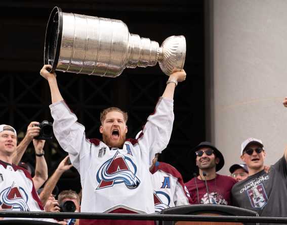 A player hold the Stanley cup in the air after Colorado Avalanche win in 2022