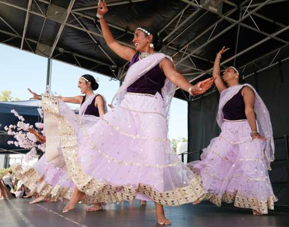 Dancers perform on stage at the Colorado Dragon Boat Festival.